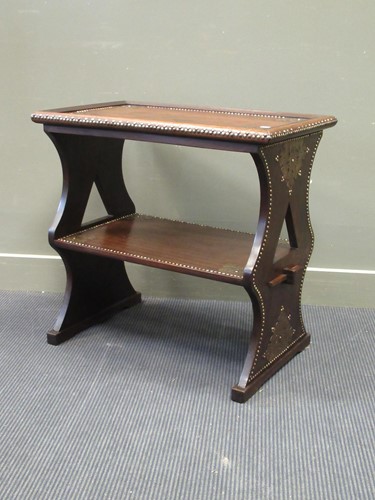 Lot 450 - An East African hardwood two tier table with...