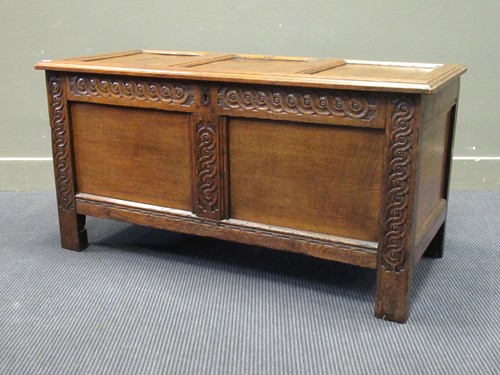 Lot 437 - An 18th century panelled oak coffer with...