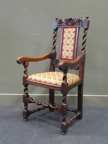 Lot 423 - A 19th century carved oak elbow chair with...