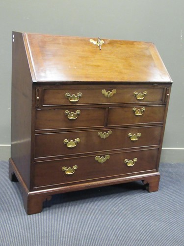 Lot 487 - A George III mahogany bureau, the fully fitted...