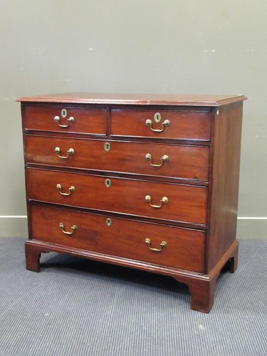 Lot 447 - A George III mahogany chest of two short over...