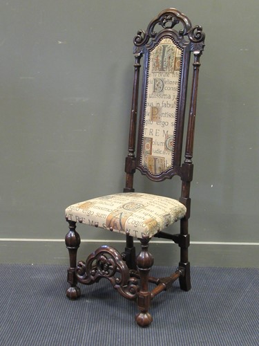 Lot 572 - A Carolean style carved oak high back chair