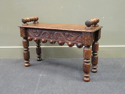 Lot 458 - A late Victorian carved oak stool with turned...