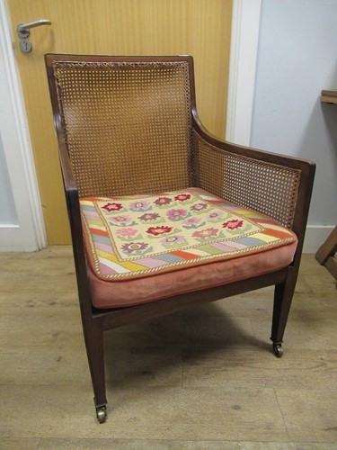 Lot 570 - An Edwardian mahogany bergère armchair...