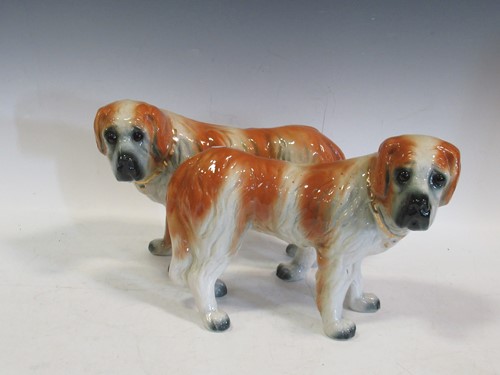 Lot 128 - A pair of antique Staffordshire St Bernard dog...