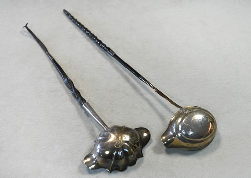 Lot 388 - A George II silver punch ladle together with a George III example