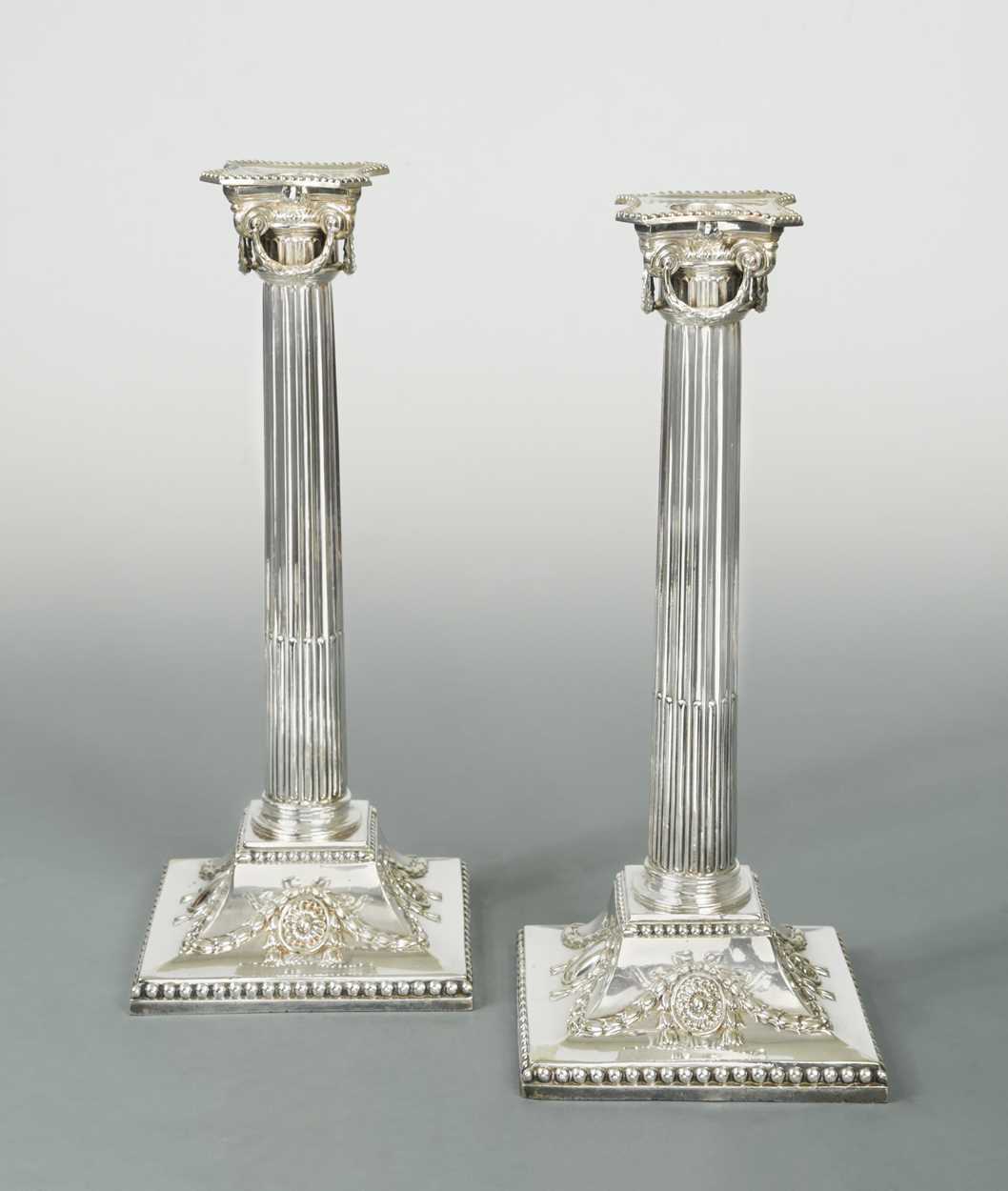 Lot 364 - A pair of silver-plated candlesticks