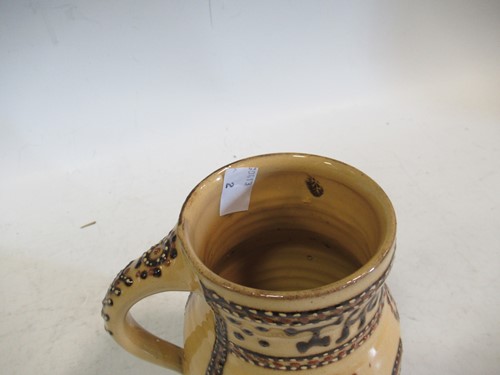Lot 172 - 'Thomas Toft' reproduction slipware mug,...