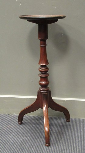 Lot 516 - A 19th century mahogany tripod torchere or...