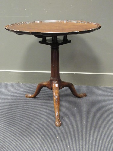 Lot 533 - A George III style carved tripod table, with...