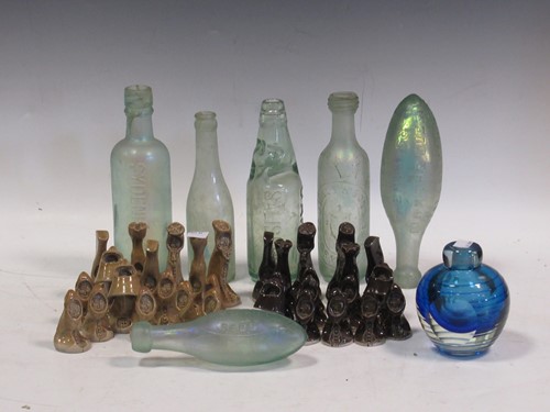 Lot 101 - A collection of Japanese wooden dolls, bottles,...