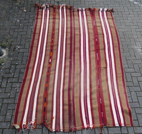 Lot 586 - A 'tribal rug' possibly Afghan or African with...