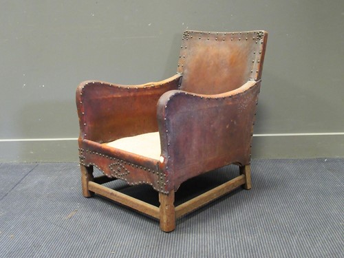 Lot 530 - A 20th century leather studded deep armchair...