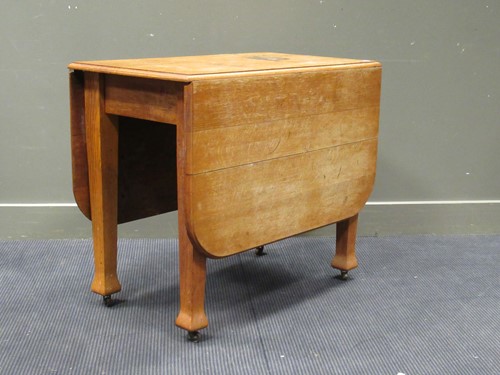 Lot 473 - A 1920’s oak drop leaf table and four bar and...