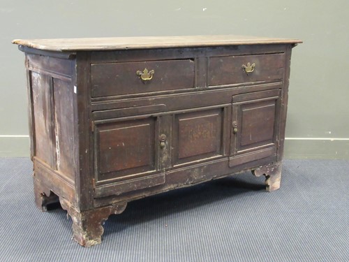 Lot 494 - An 18th century oak cupboard with two drawers...