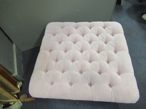 Lot 418 - A pink velvet style buttoned upholstered foot...
