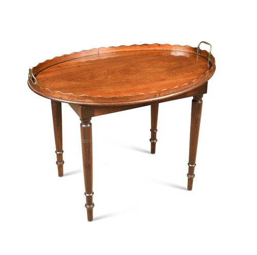 Lot 297 - A George III mahogany wavy edge tray