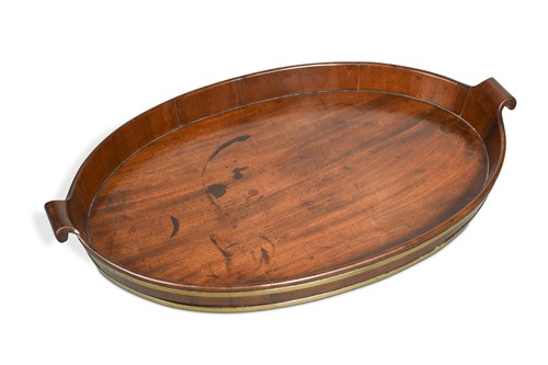 Lot 402 - A George III mahogany oval tray