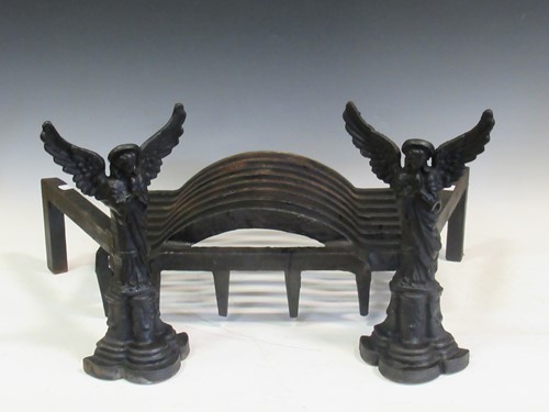 Lot 148 - A pair of cast iron angel Fire-dogs and grate,...