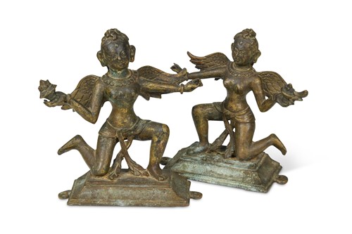 Lot 181 - A matched pair of Tibetan bronze figural altar appliqués, probably 18th century