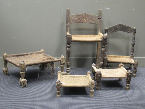 Lot 732 - A South Nepal carved wood high chair with woven jute seat