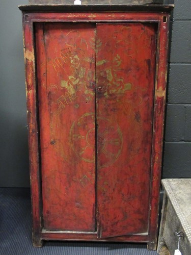 Lot 734 - A Tibet red painted wood cupboard