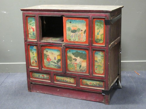 Lot 483 - A Sino Tibetan eleven panel fronted cupboard, early 20th century