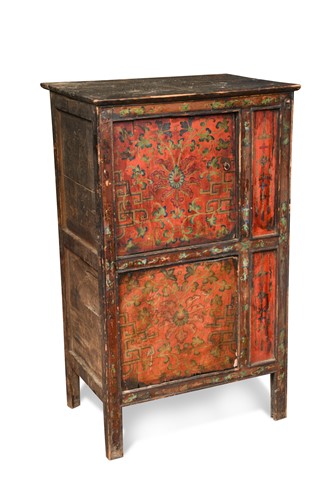 Lot 279 - A Tibetan upright four panelled two tier cupboard