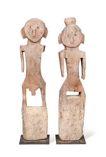 Lot 350 - A pair of Southern Nepalese primitive carved wood figures, Terai Province, early 19th century