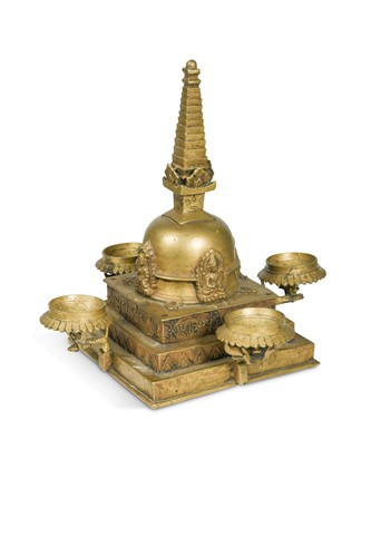 Lot 220 - A Central Nepal (Newar Caste) brass stupa, 19th century