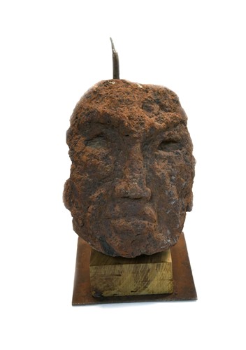 Lot 291 - A carved tufa primitive head of a man, Saint-Pons, Ardèche Region, circa 1950