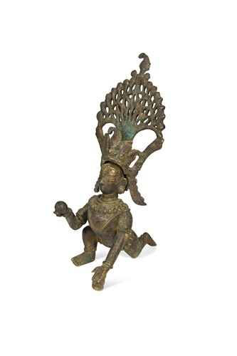 Lot 179 - A Central Nepal (Newar Culture) bronze of the crawling baby Krishna, 18th/19th century