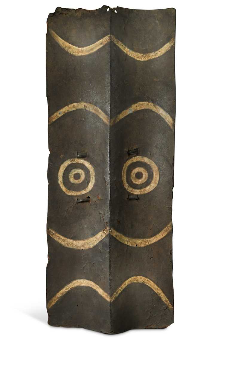 Lot 377 - A Naga warrior's painted leather shield, 19th century