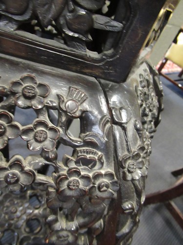 Lot 499 - Two marble inset Chinese hardwood urn stands,...
