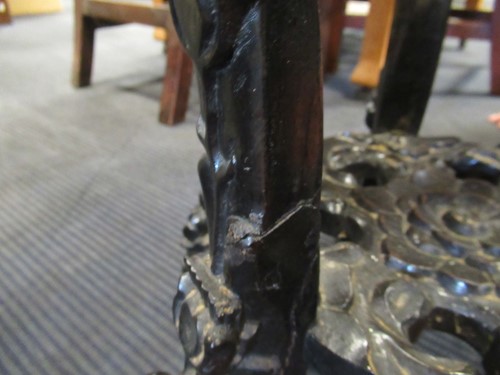 Lot 499 - Two marble inset Chinese hardwood urn stands,...
