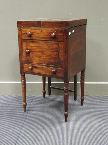 Lot 513 - A mahogany bedside cabinet with retractable...