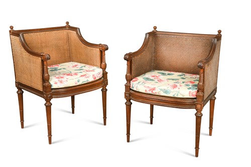 Lot 886 - A pair of neo-classical mahogany bergeres, early 20th century