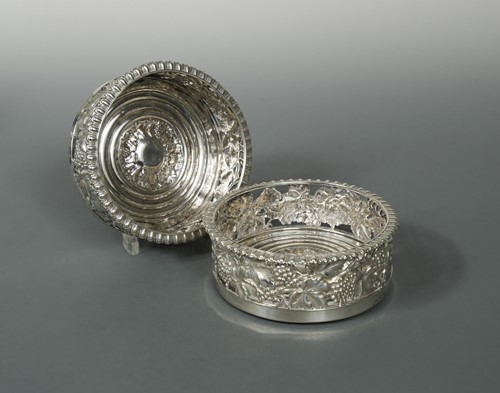 Lot 397 - An impressive and heavy pair of William IV cast silver bottle coasters