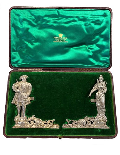 Lot 311 - A pair of German metalwares 19th century cast silver novelty menu holders