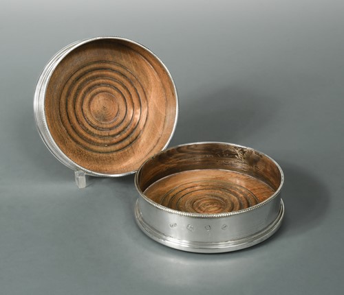 Lot 476 - A pair of 20th century silver bottle coasters
