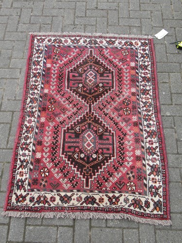 Lot 594 - A Kazak type rug, with three ivory lozenges,...
