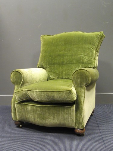 Lot 521 - A green upholstered armchair