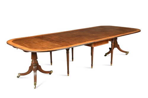 Lot 469 - A George III style crossbanded mahogany twin-pedestal dining table, late 19th/early 20th century