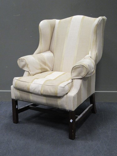 Lot 466 - A George III reproduction wing armchair,...