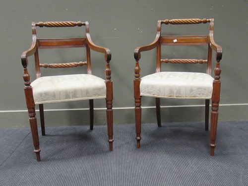 Lot 455 - A pair of Regency dining armchairs, on turned...