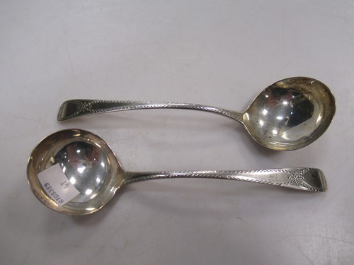 Lot 199 - A pair of George III silver sauce ladles with...