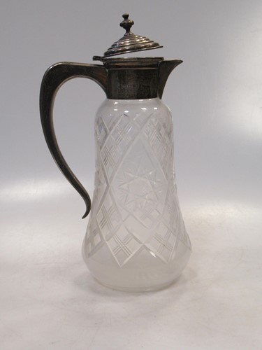 Lot 205 - A cut glass claret jug (cracked), with silver...