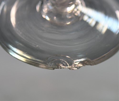 Lot 241 - Two 18th century air-twist wine glasses