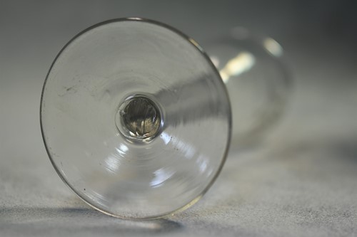 Lot 241 - Two 18th century air-twist wine glasses
