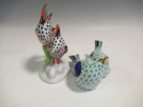 Lot 106 - A Herend green fishnet model of lovebirds and...